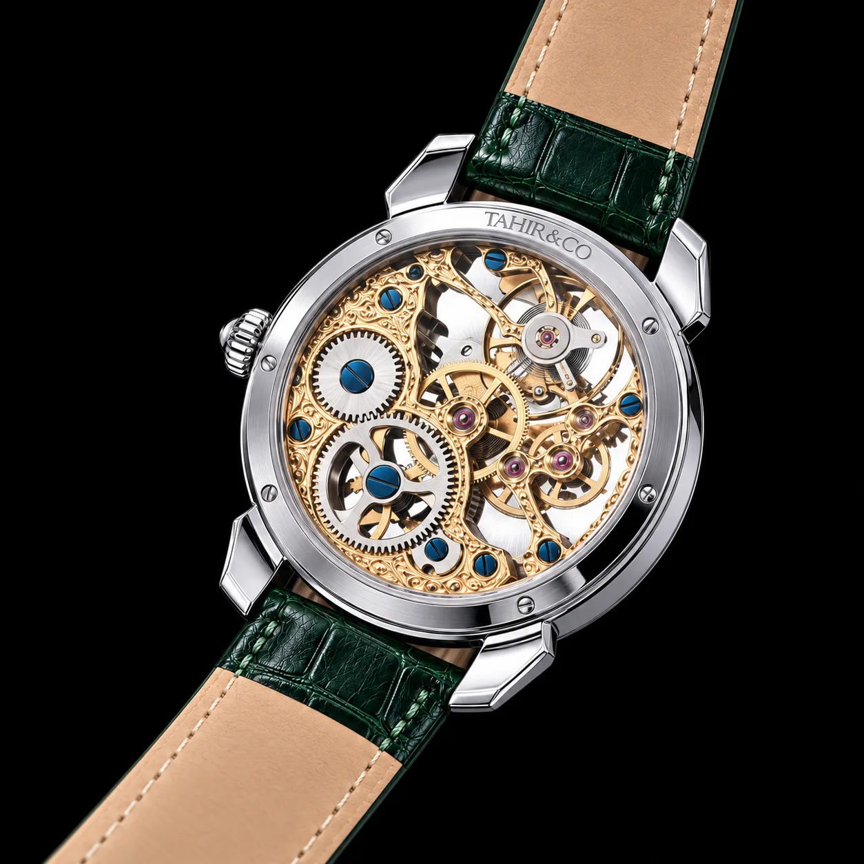 Back of the TAHIR & CO watch showing the engraved gold skeleton movement with blue screws through the sapphire caseback